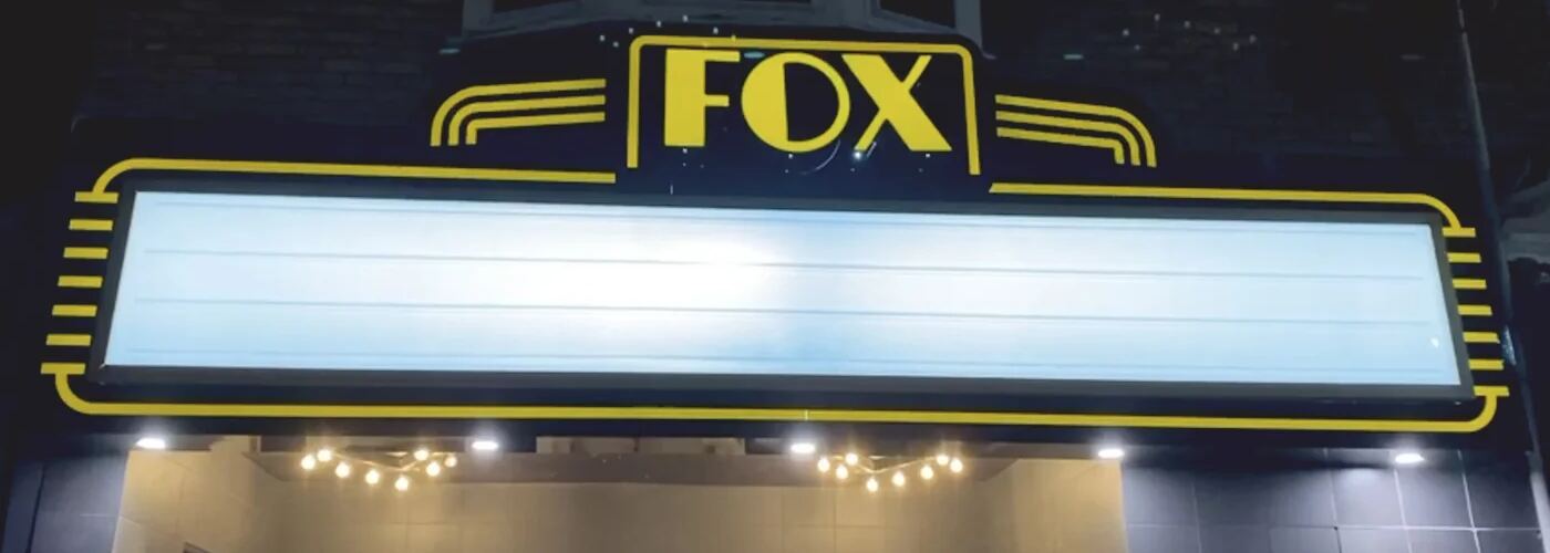 The Fox marquee letter board, lit