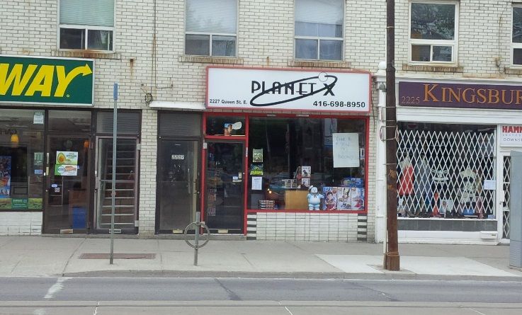 The Planet X storefront at 2227 Queen Street East, red-trimmed windows under a white Planet X sign