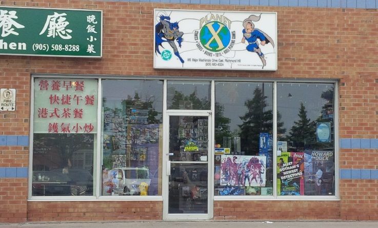 The Planet X Richmond Hill storefront, windows full of comic posters under the Planet X sign